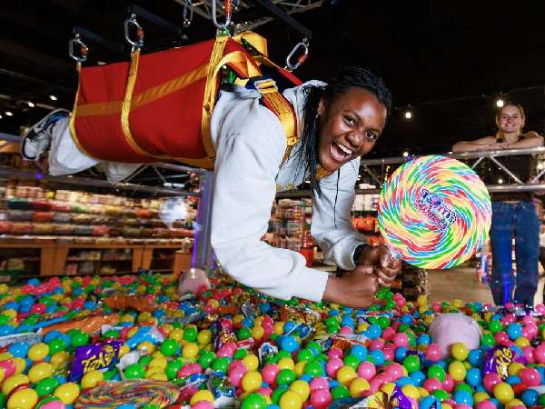 A human claw machine at a promotional event