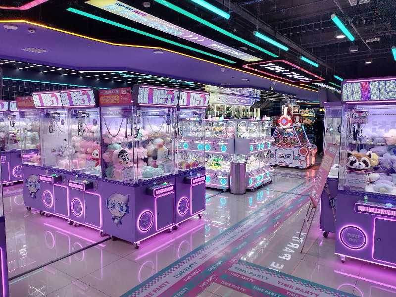 A commercial arcade filled with various claw machines